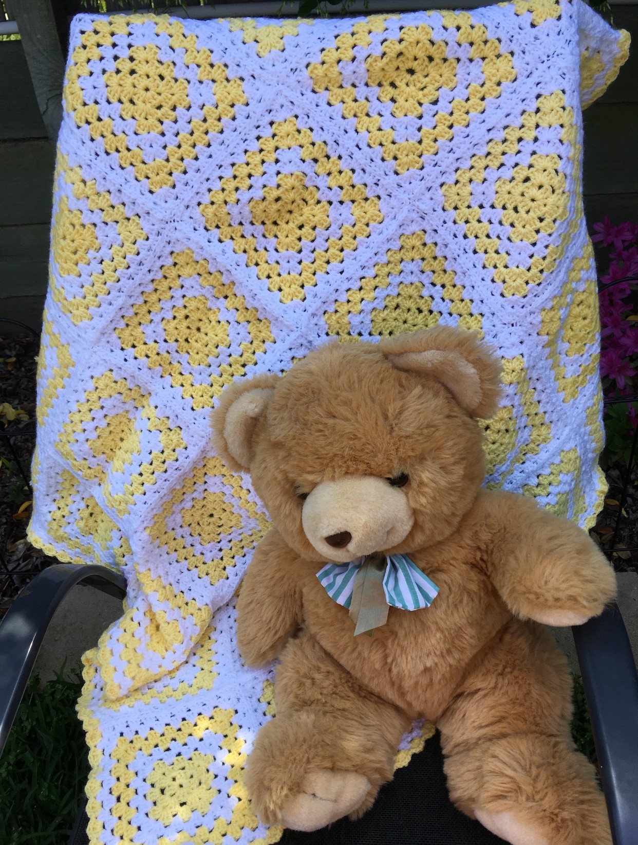 Cot rug with lemon and white squares.
