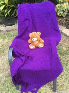 Purple Tasselled Rug with horizontal ridged stitching